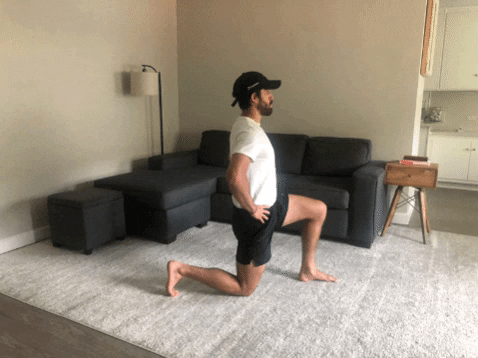 Guy doing hip flexor stretch